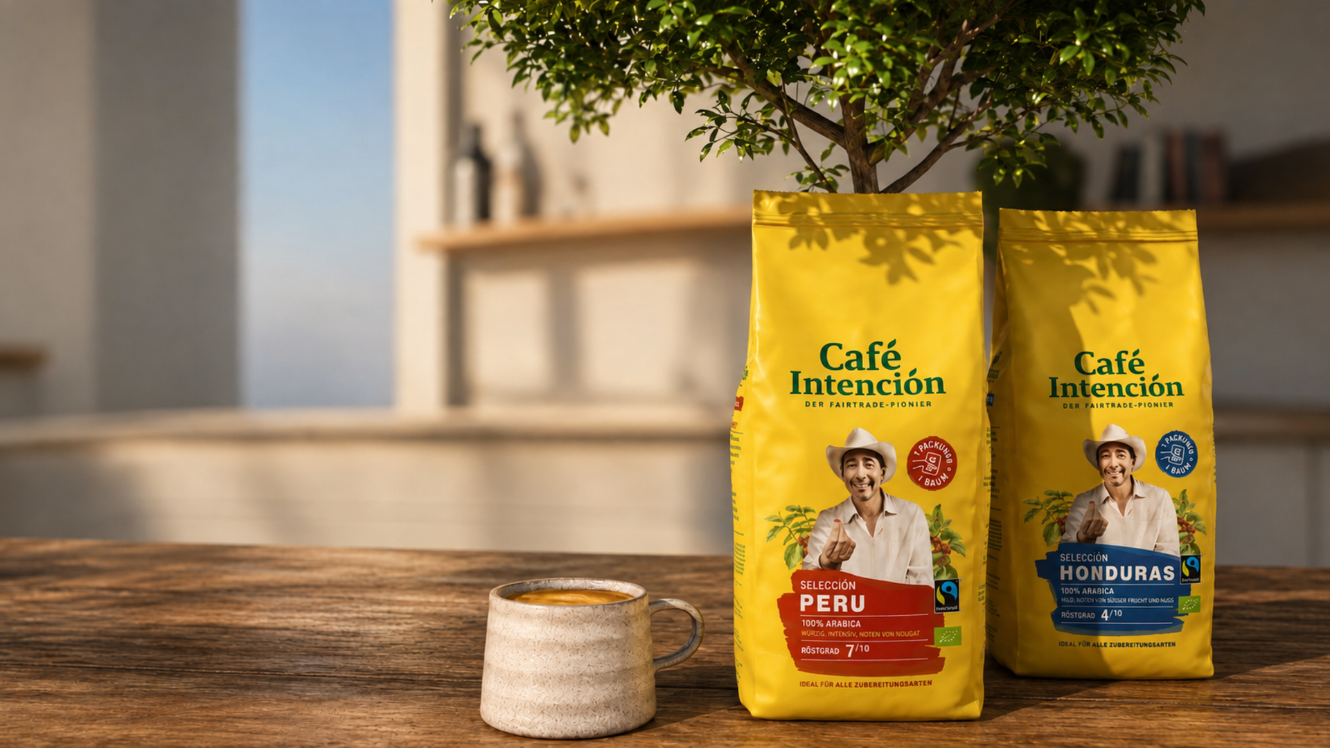 Fairtrade Café Intención coffee bags from Peru and Honduras beside a rustic mug on a wooden table.